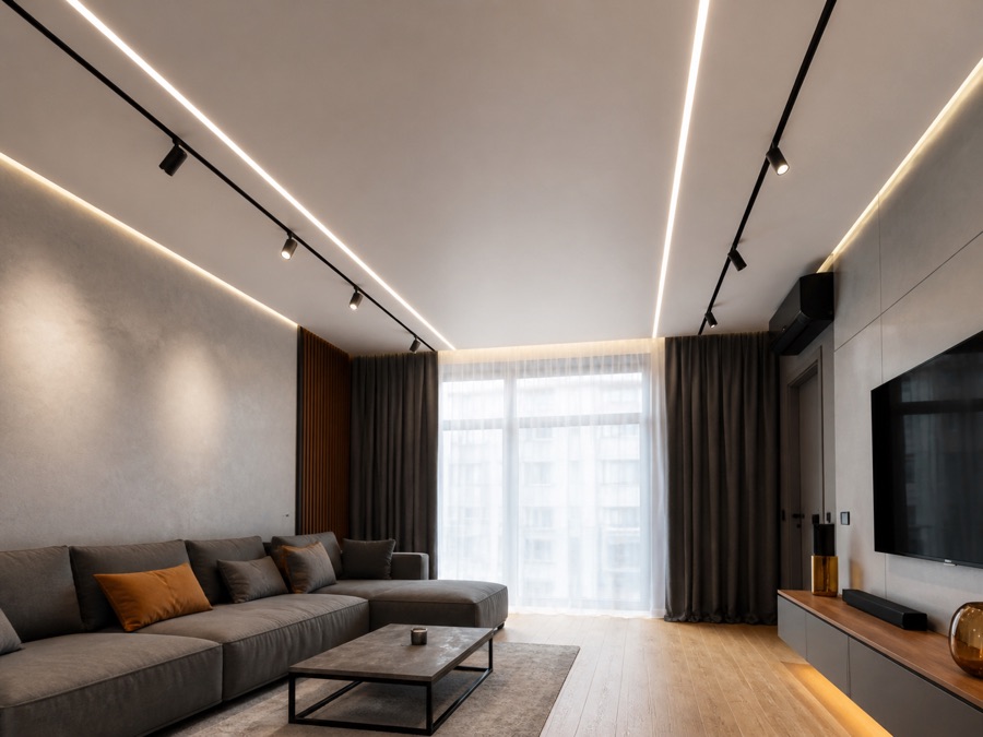 Stretch ceiling with LED light lines and track lighting